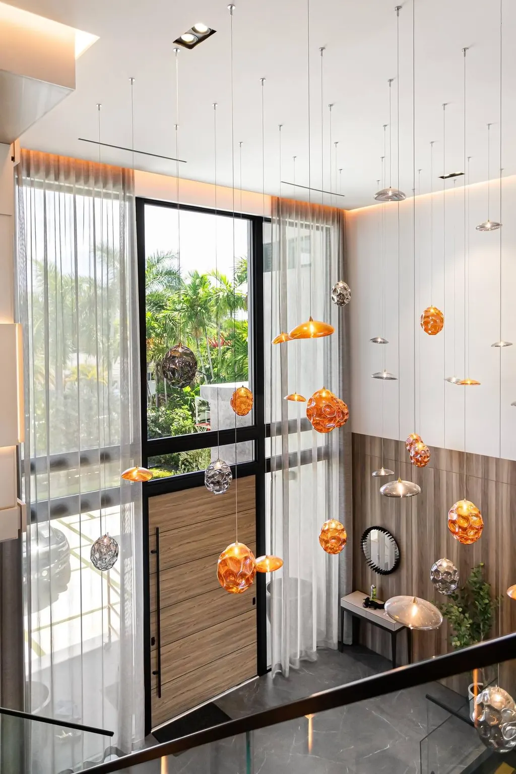 double-height sheer curtains in entry foyer, Bal Harbour
