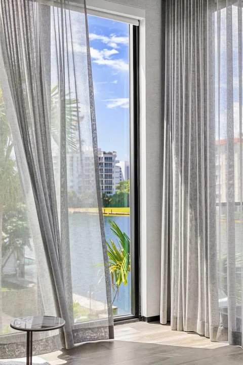 corner sheer curtains with Intracoastal view in living room, Bal Harbour