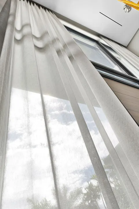 floor-to-ceiling sheer curtains at corner window, Bal Harbour