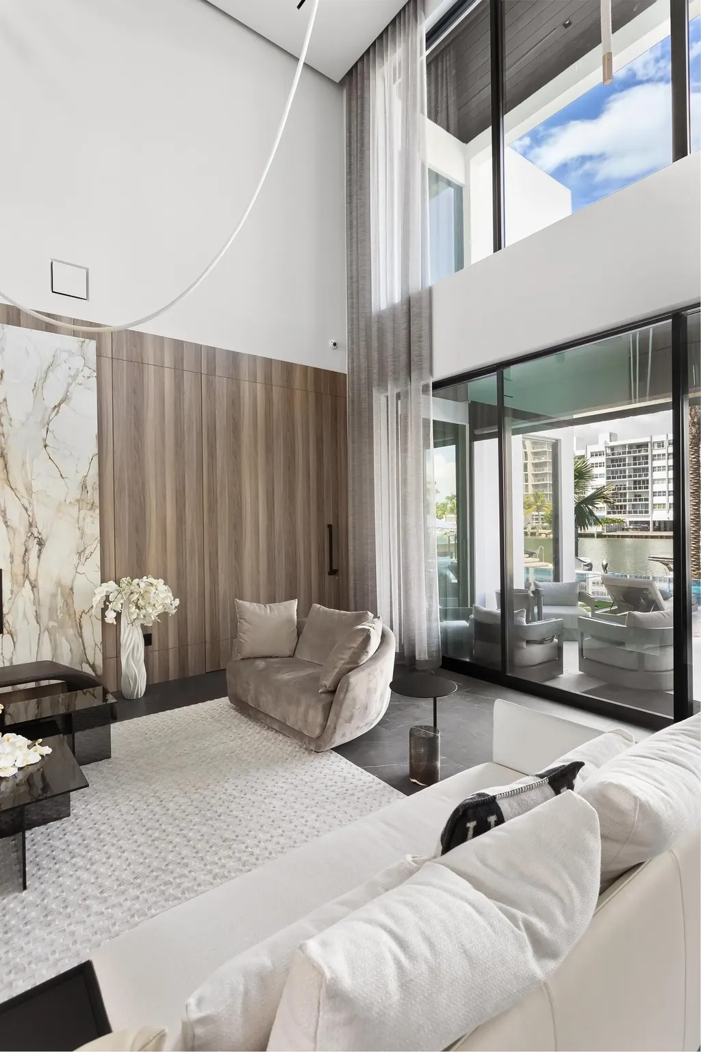 sheer drapery in double-height living room, Bal Harbour