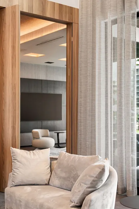 sheer curtains in sitting room with wood paneling, Bal Harbour